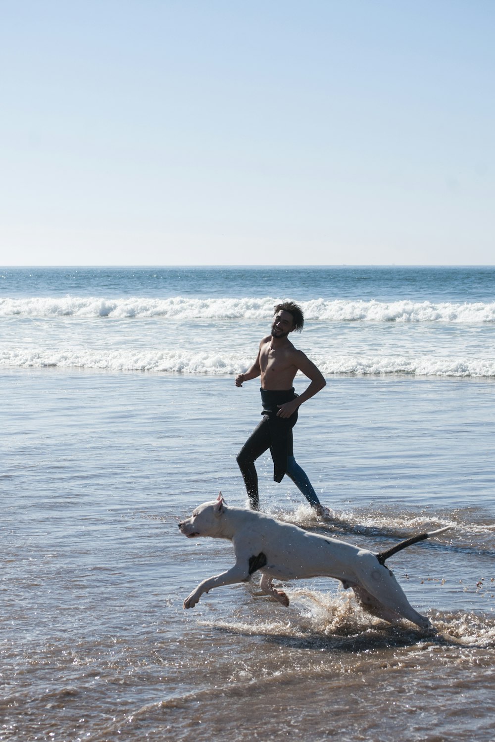 man running together with dog