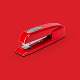 A variety of staplers in different colors and designs.