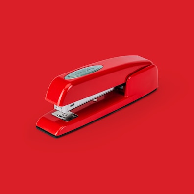 A variety of staplers in different colors and designs.