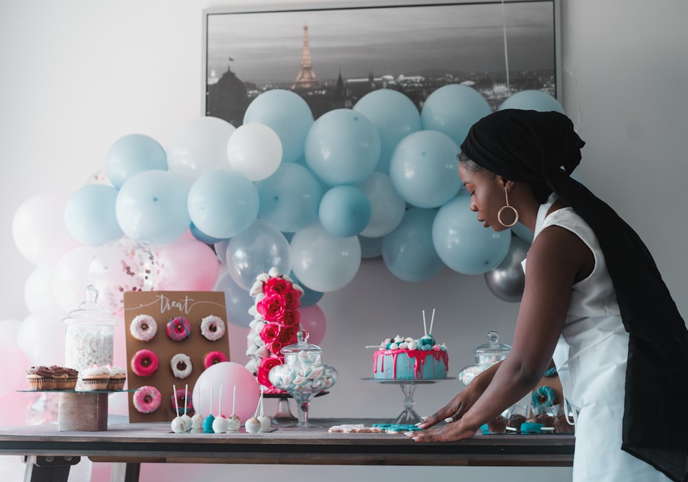 woman in front of balloons