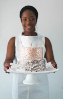 woman carrying cake