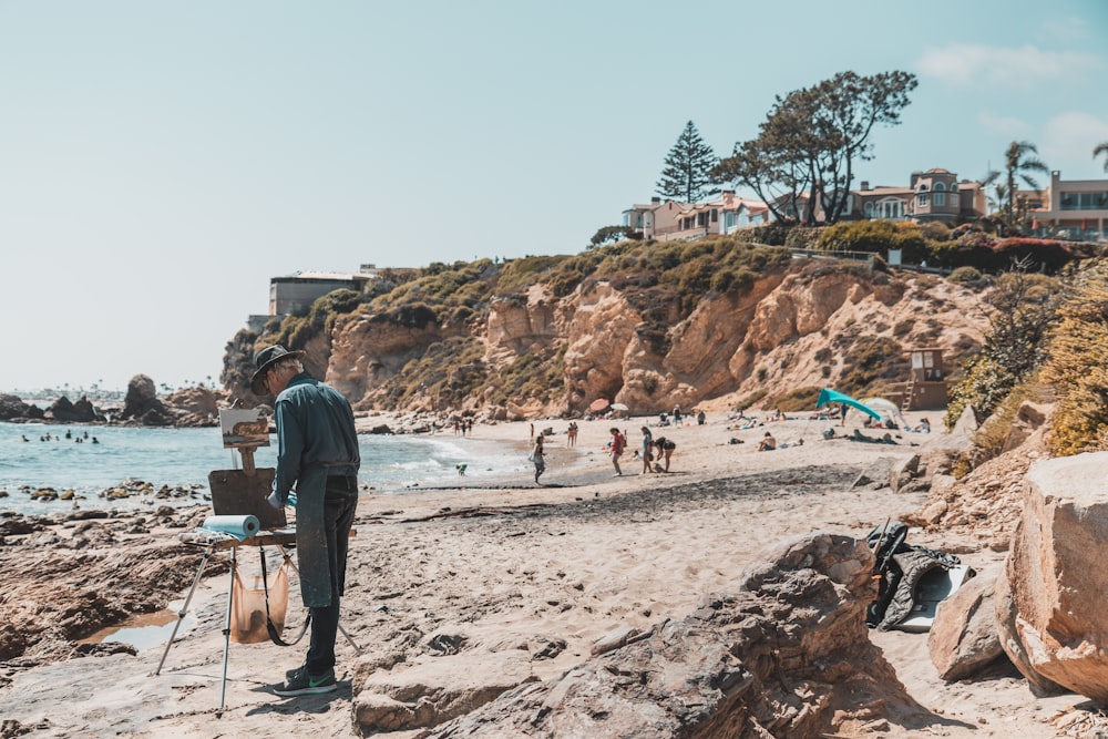 people standing beside body of water during daytime