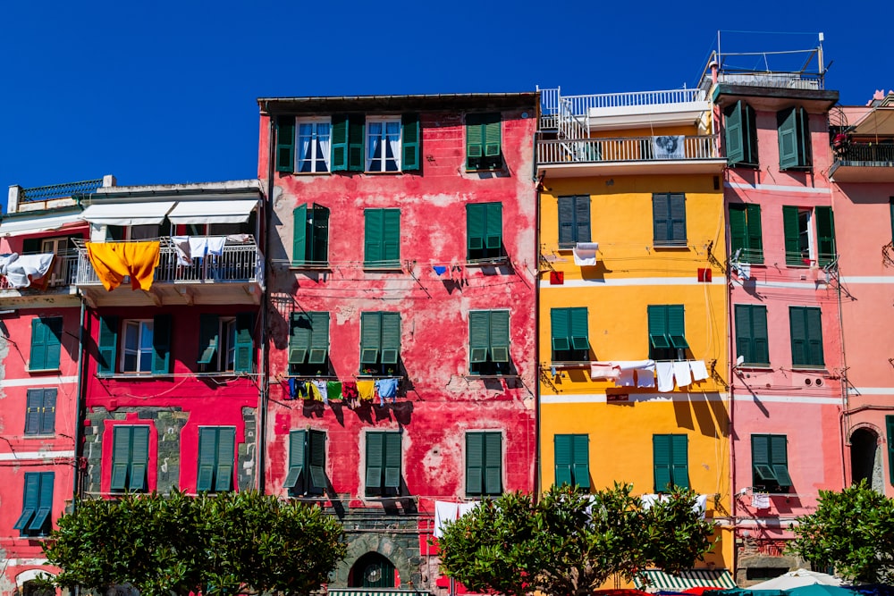 red, yellow, and pink concrete house