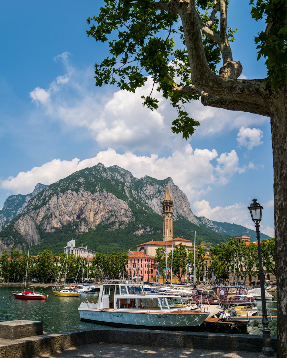 brown tower across gray mountain during daytime