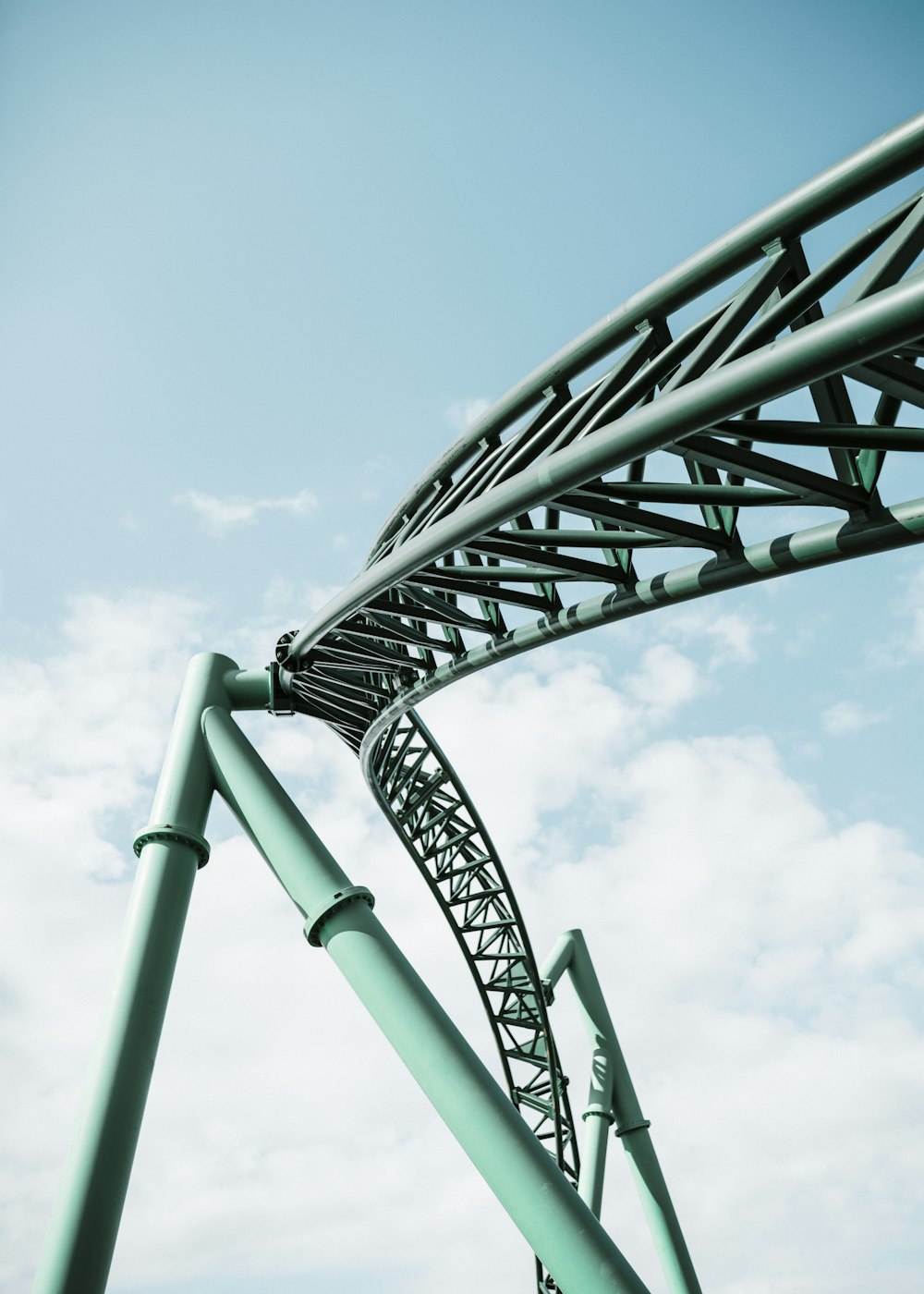 green and black metal bars close-up photography