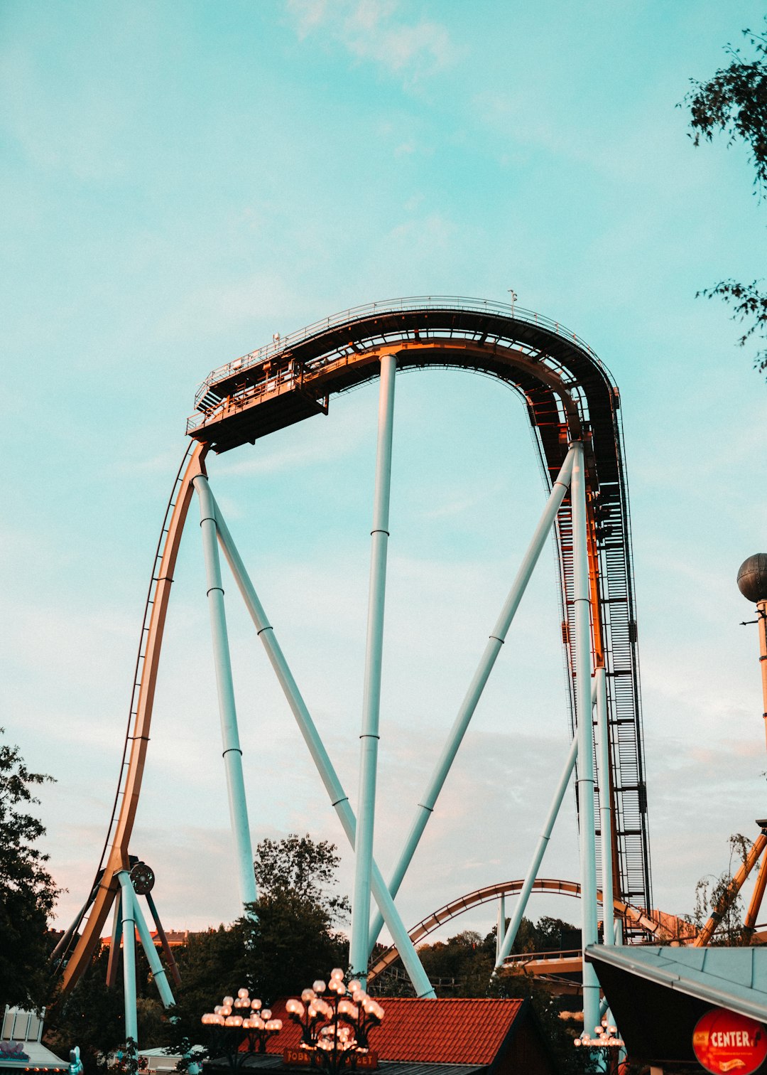 gray roller coaster under cloudy sky