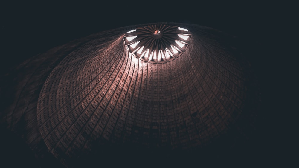 a circular light fixture in a dark room