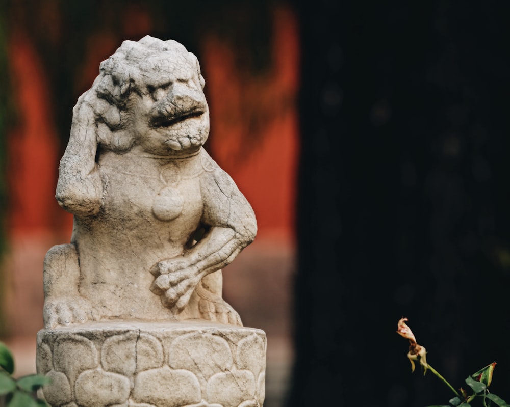 white and gray concrete statue close-up photography