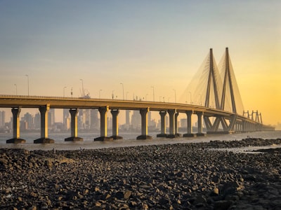 brown bridge during golden hour mumbai google meet background