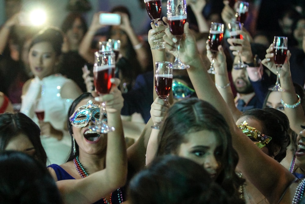 group of women raising champagne flutes