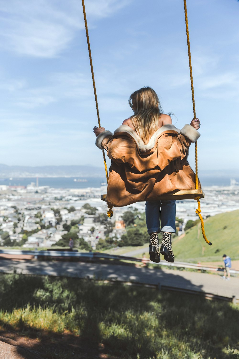 woman swinging during daytime