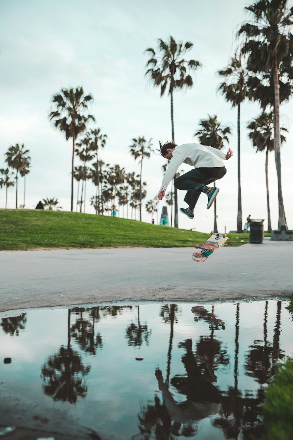 man riding on skateboard on road