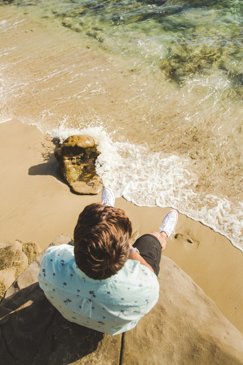 man sitting at the cliff edge