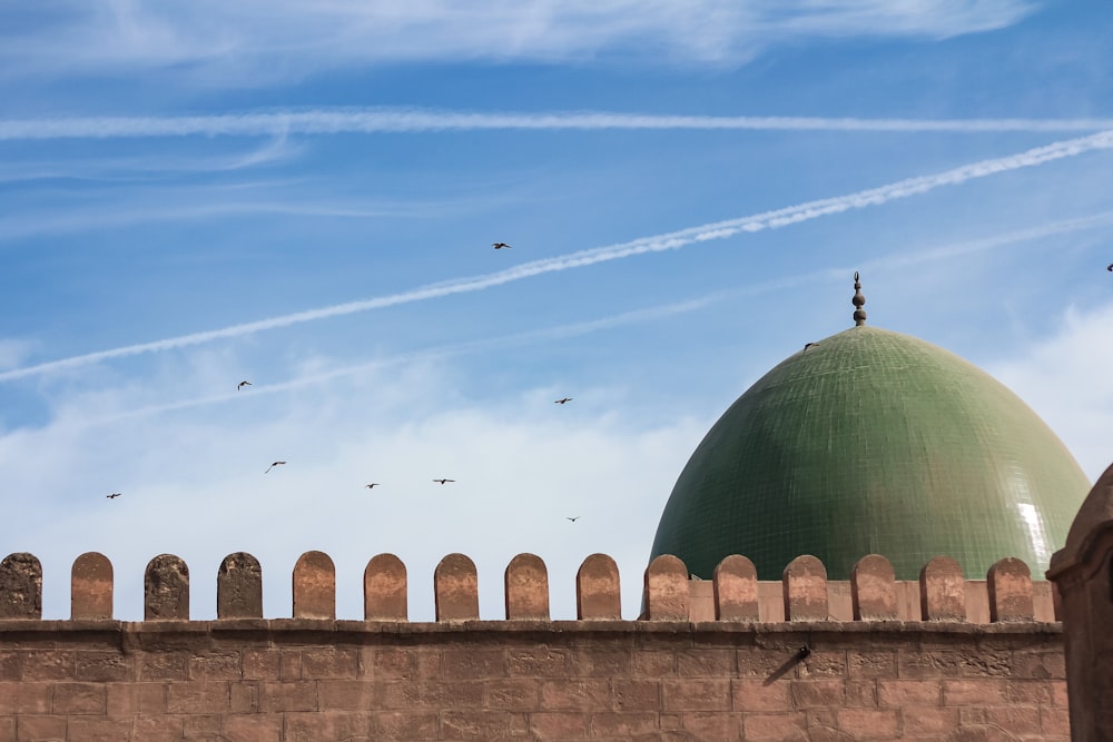 a large green dome on top of a building