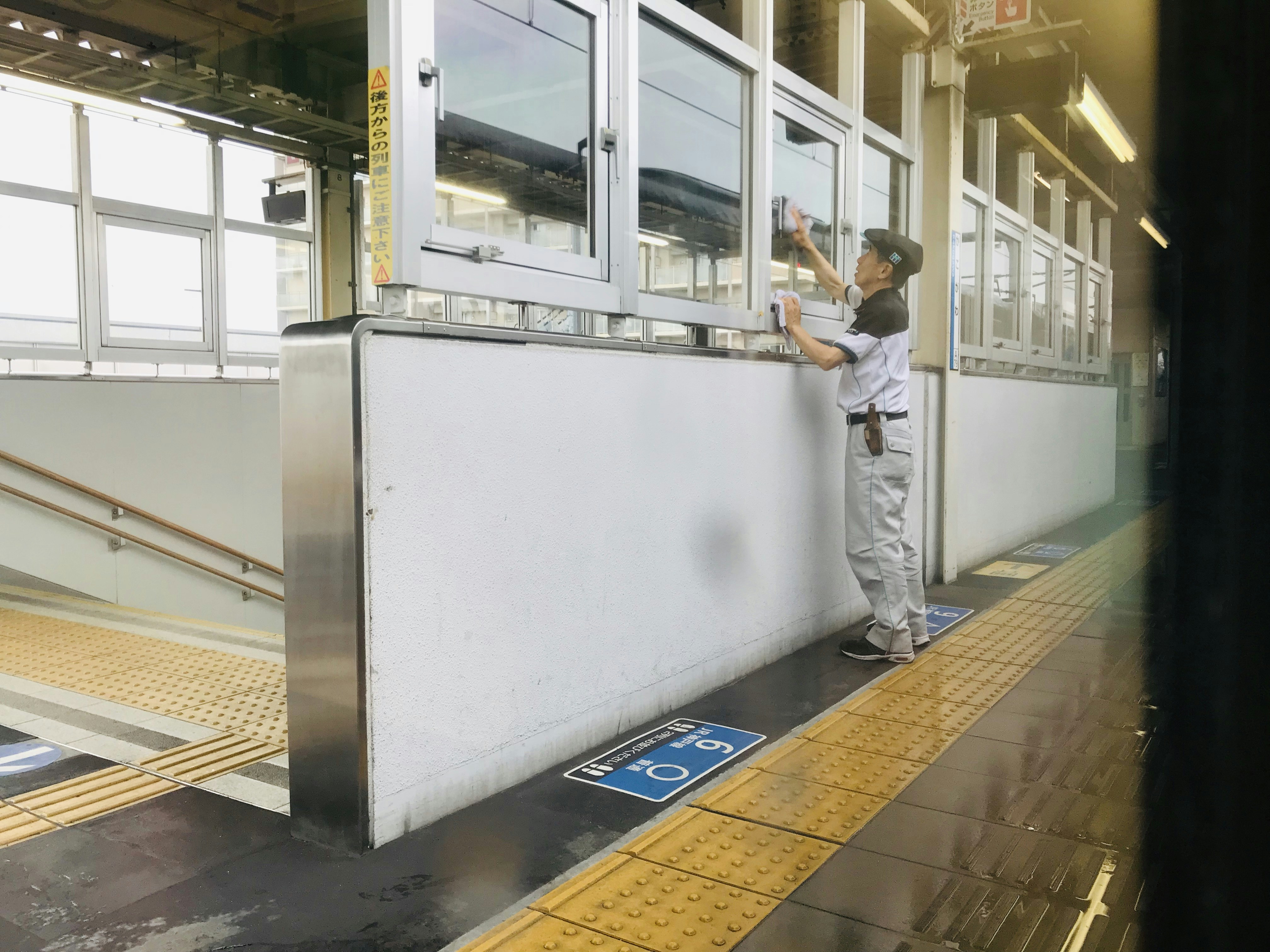 Person slipping on ice at a train station, motion blur