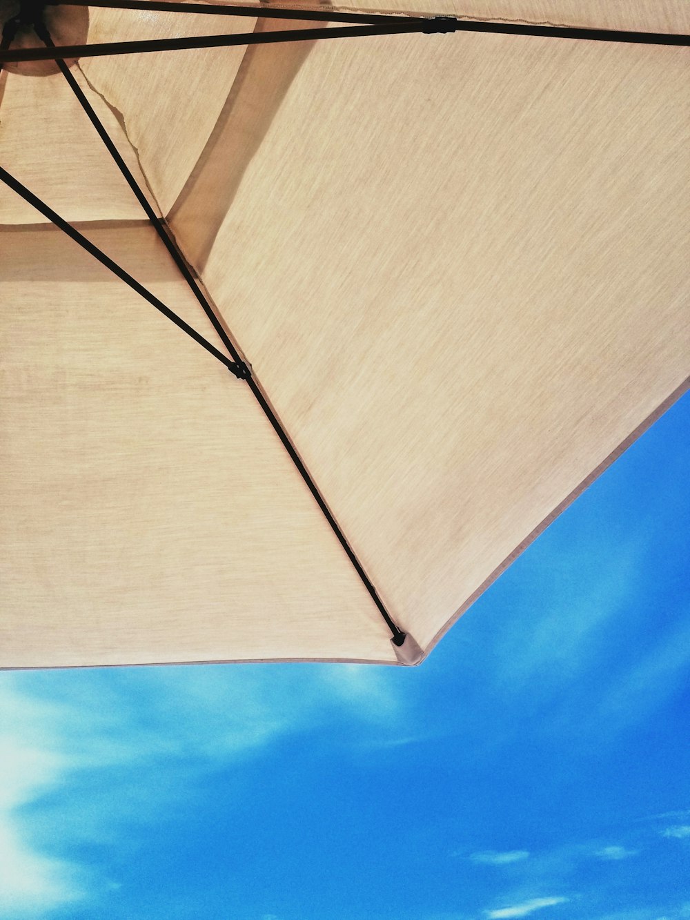 beige parasol umbrella