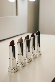 five assorted-color lipsticks