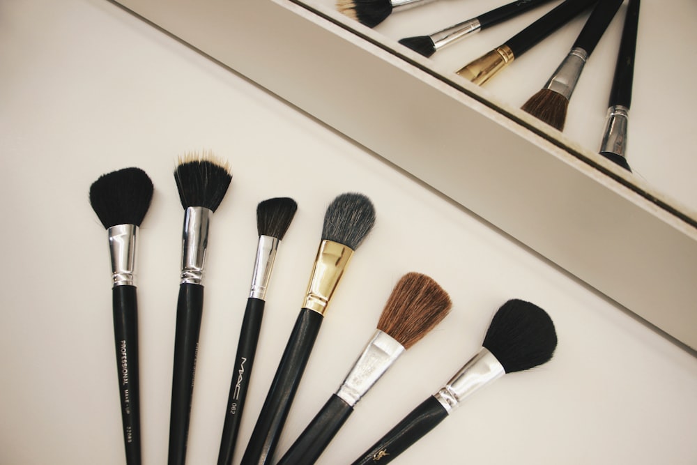 assorted-color makeup brushes