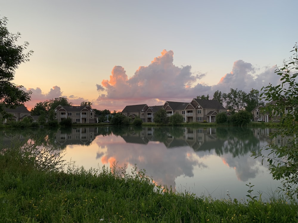 reflection of houses on body of water