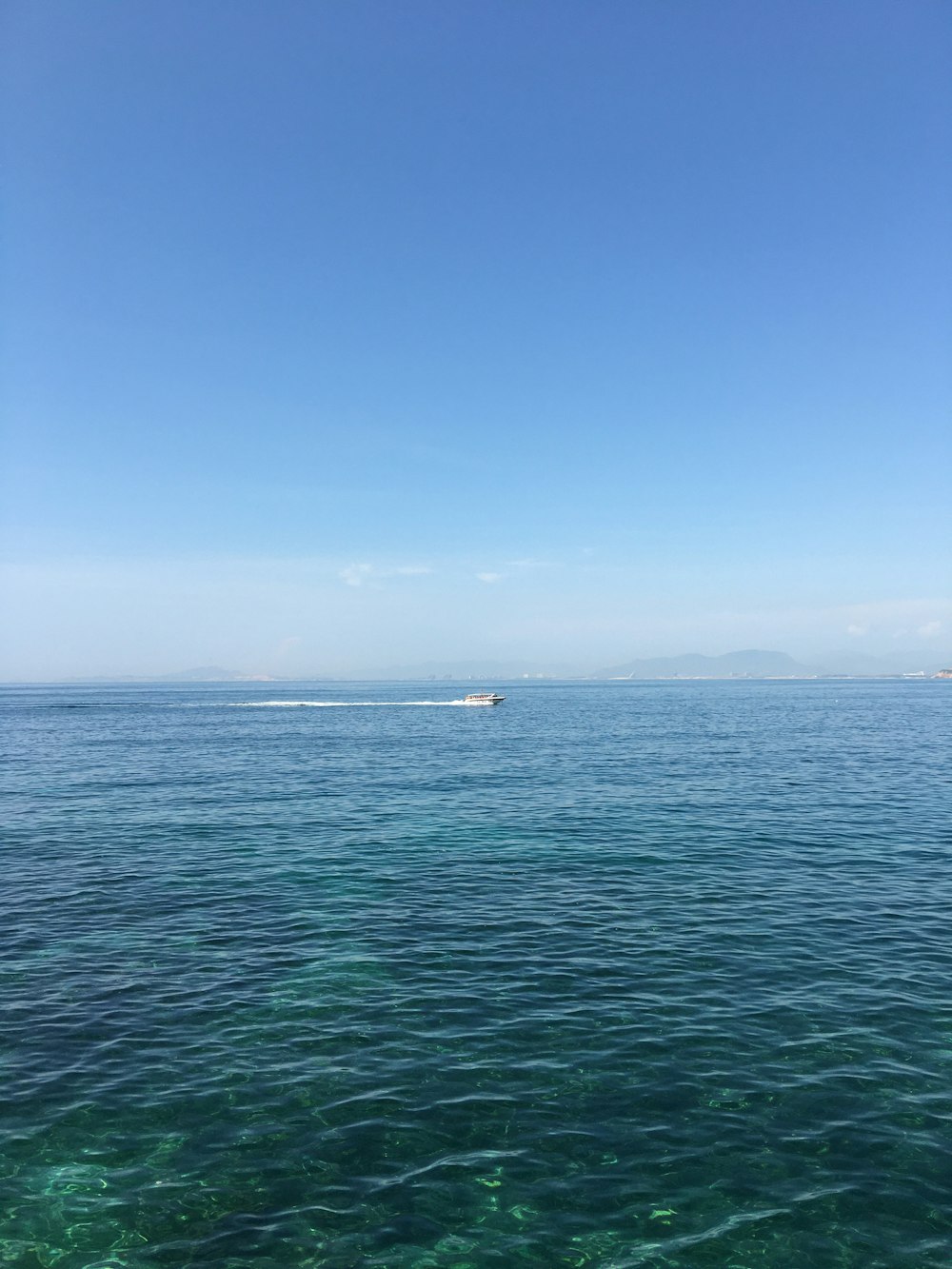 boat on ocean during daytime