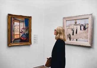 woman looking at painting