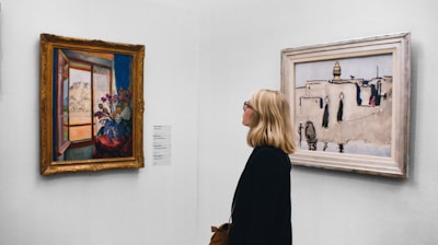 woman looking at painting