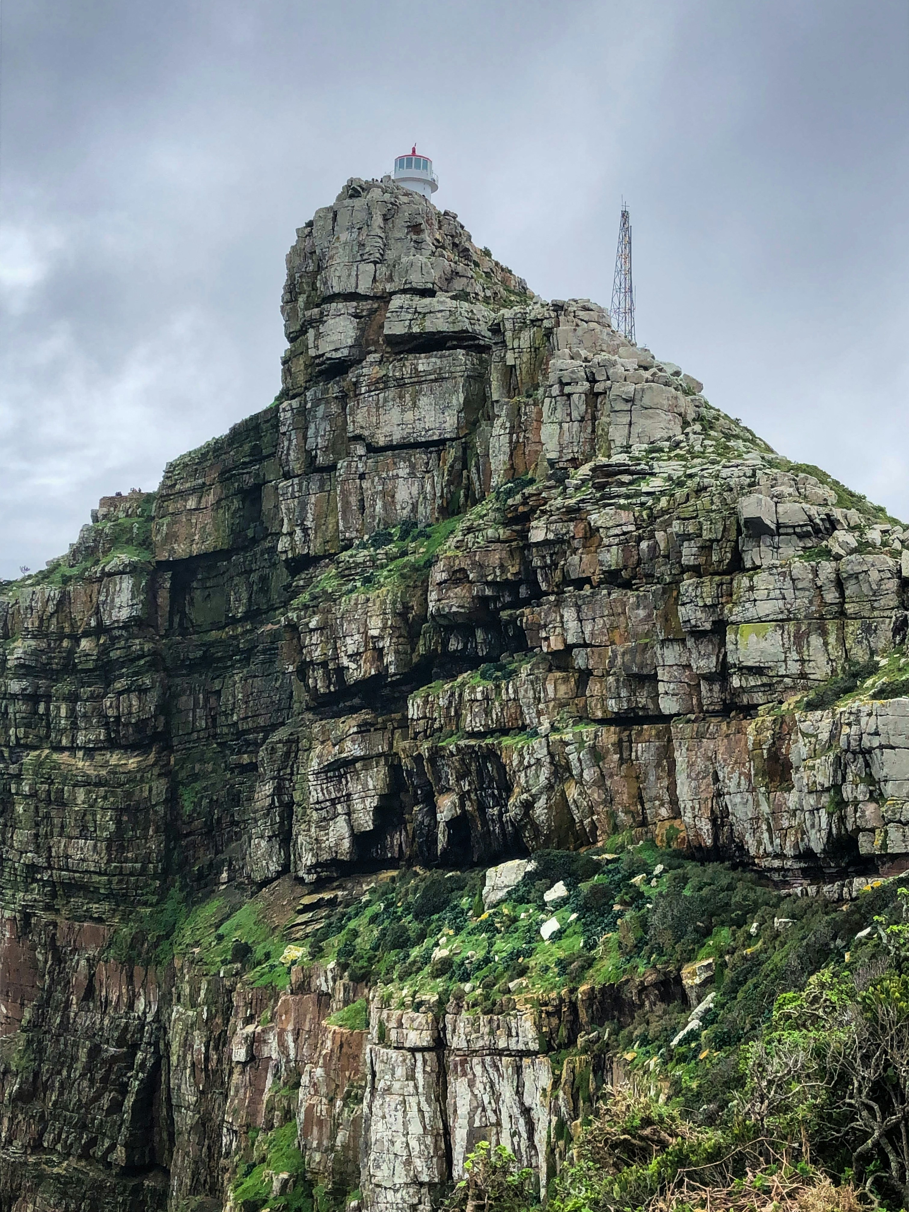 a very tall mountain with a radio tower on top of it
