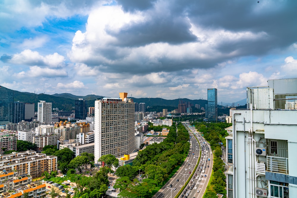 aerial photography of buildings near highway during daytime