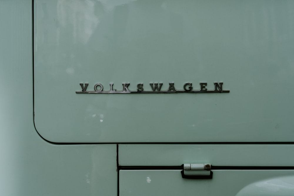 a close up of the word volkswagen on the side of a white
