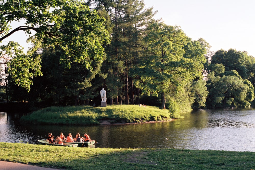 a group of people in a small boat on a river