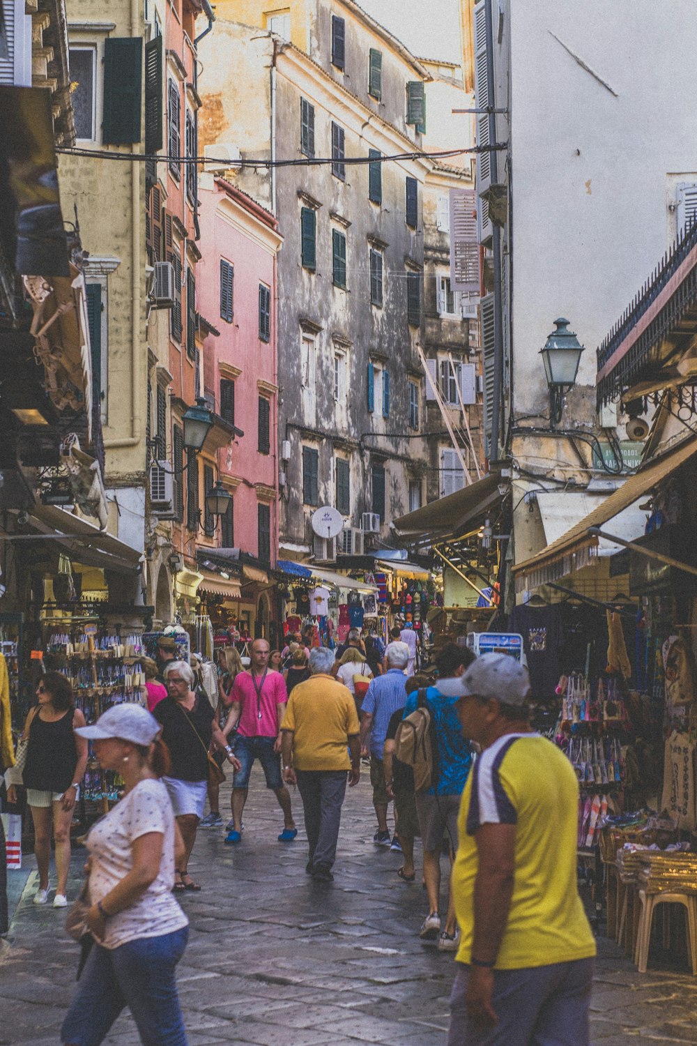 people walking between buildings