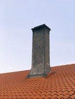 a chimney on the roof of a house
