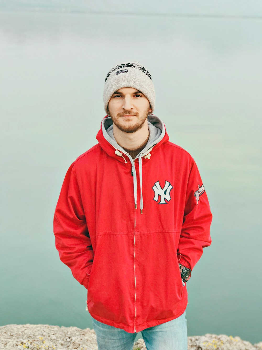 man wearing red and gray New York Yankees hoodie