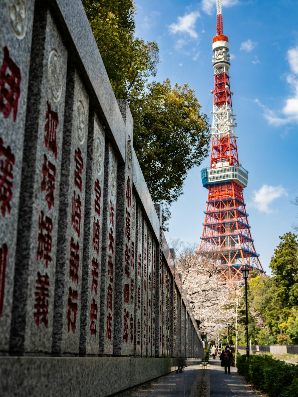 red and white tower under blue sky