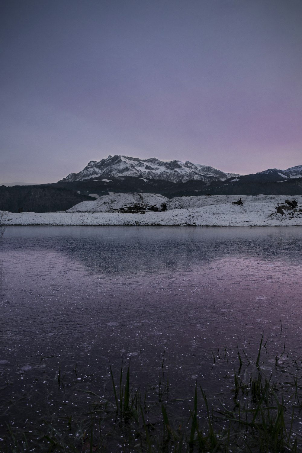 body of water near mountain