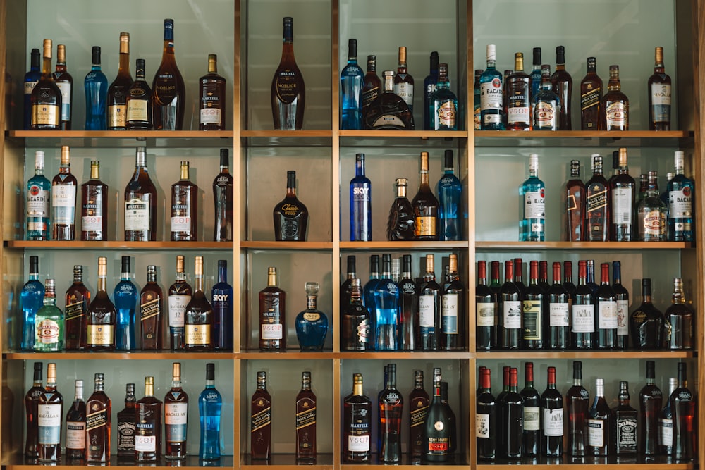 shelf of assorted-brand liquor bottles