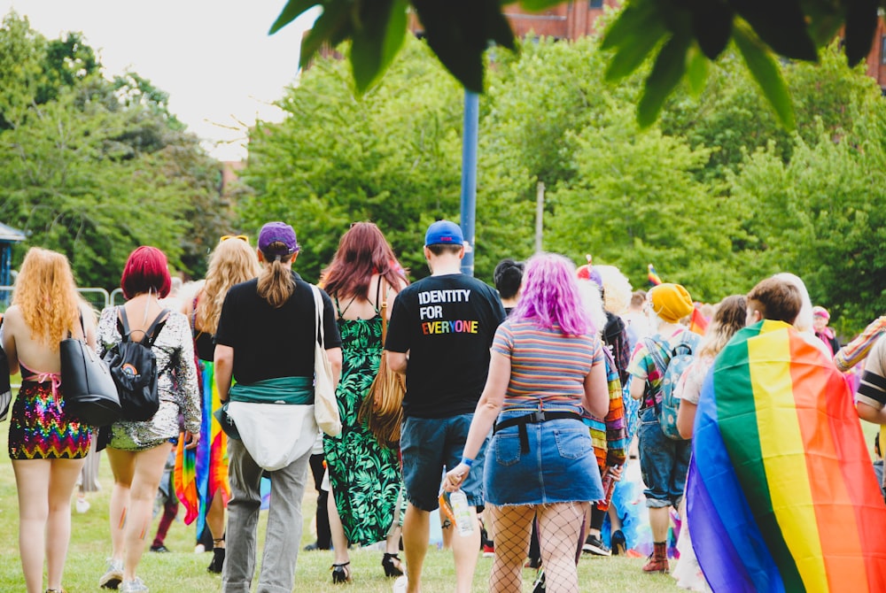 people gathering near trees