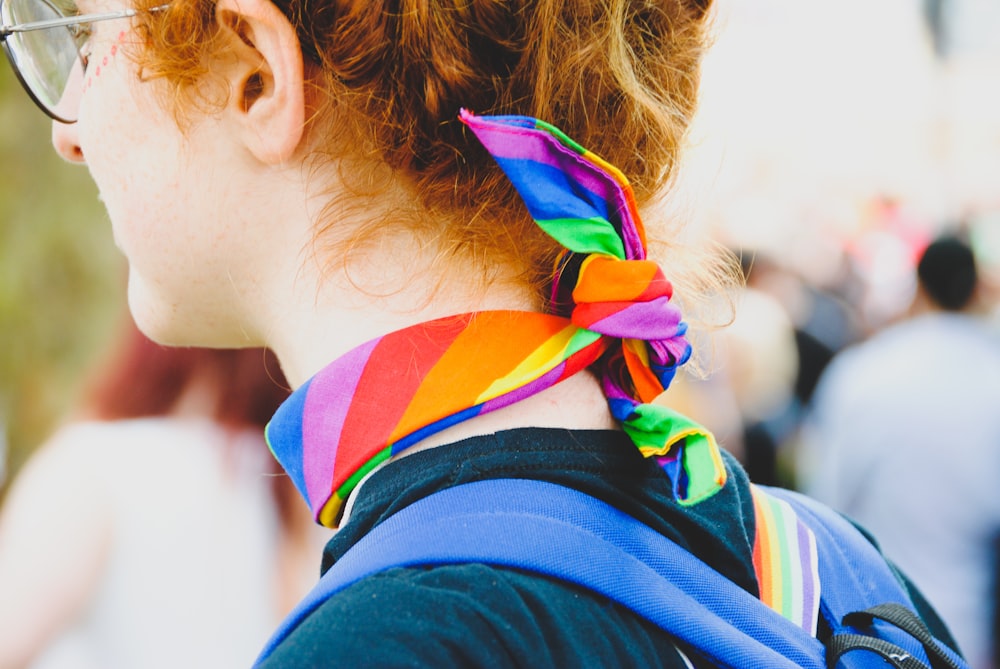 person wearing multicolored scarf