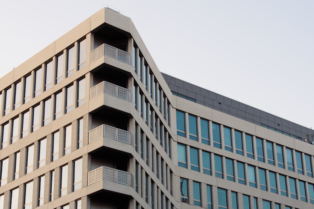 beige building with glass windows,