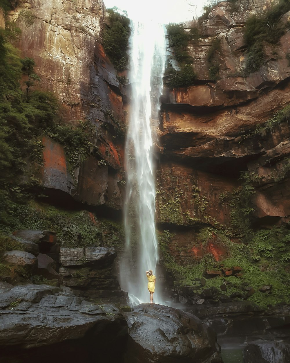 person on waterfall