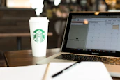 A creative workspace with notes and a coffee cup, symbolizing digital marketing ideas.