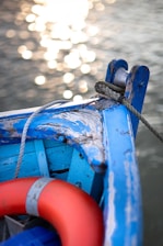 Close-up of a boat with freshly installed navy blue canvas covers glistening under the sun.