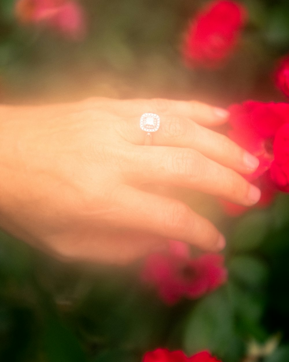 person wearing silver-colored ring