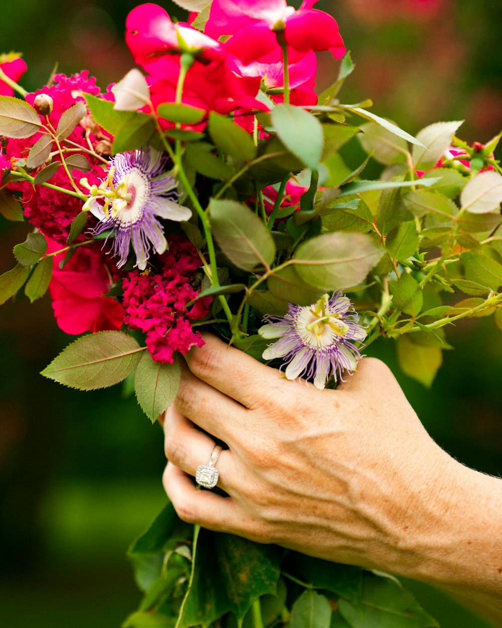 person holding bouquet of flower