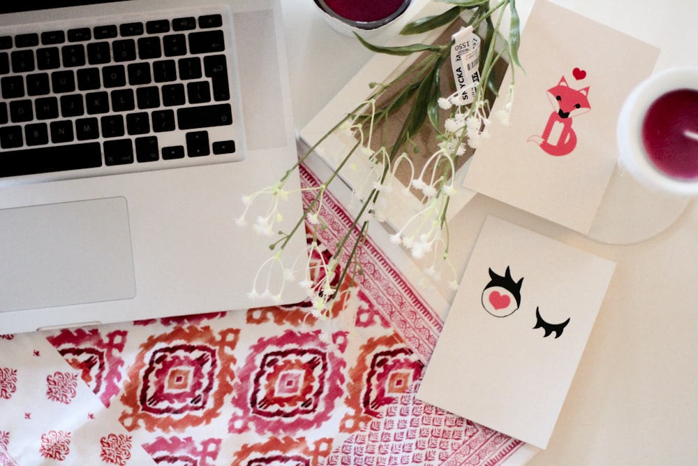 laptop beside flowers