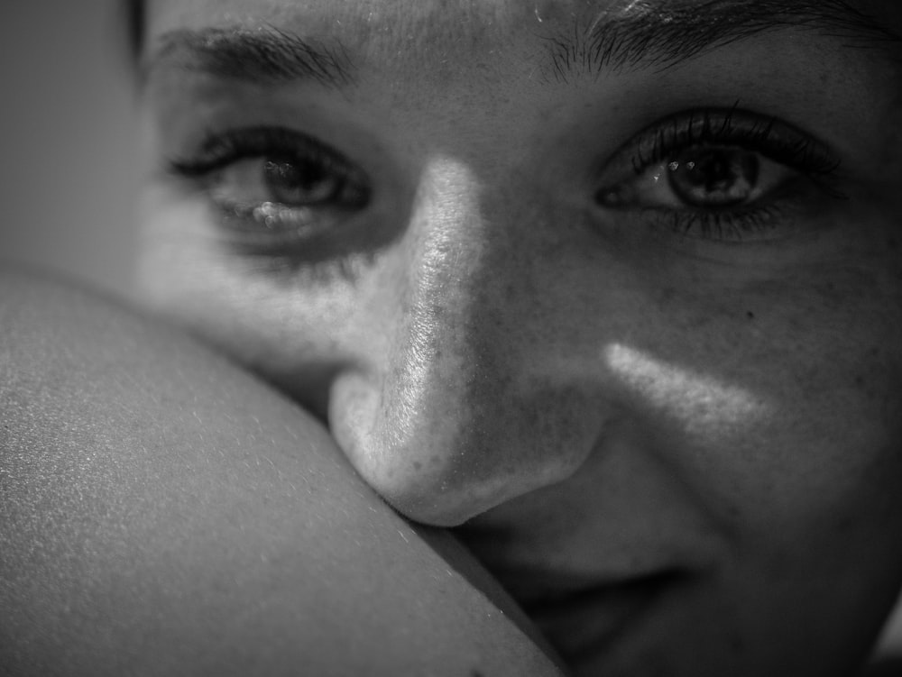 a black and white photo of a woman's face