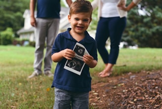 boy holding ultrasound result