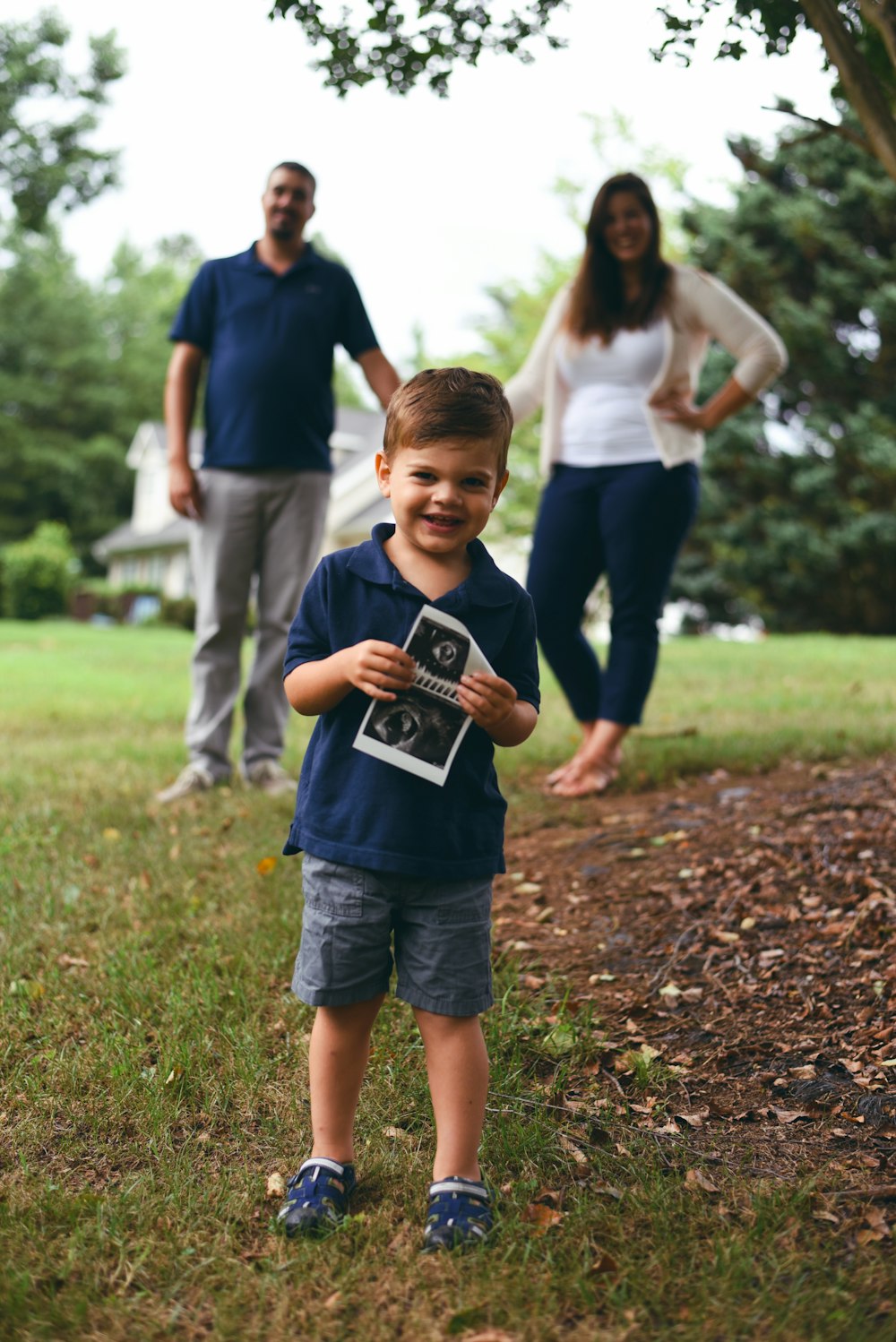 boy holding ultrasound result