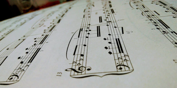 Close-up of detailed musical royalty graphs and charts on a modern screen, with notes floating around.