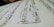 A close-up view of a sheet of musical notation featuring various notes, clefs, and musical symbols laid out on a staff. The image focuses on the details of the music manuscript with emphasis on the notes and lines.
